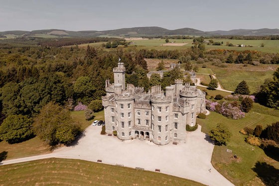 view of cluny castle from drone with surrounding land